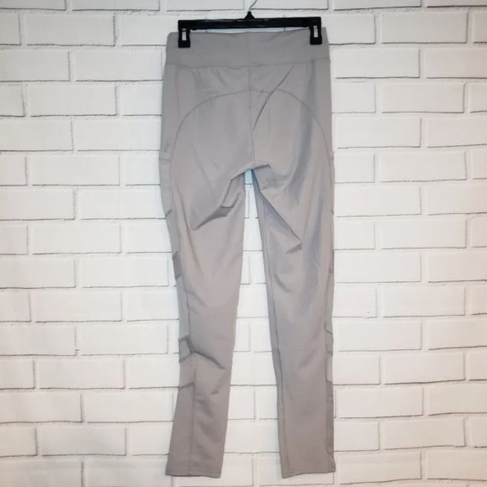 NWT JVINI gray leggings with sheer‎ side pa…